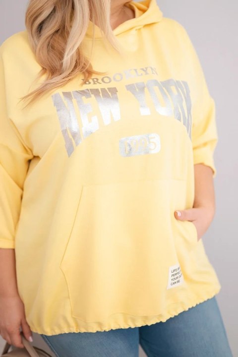 Bluza damska Plus Size masełko z kapturem i kieszenią kangurką żółta
